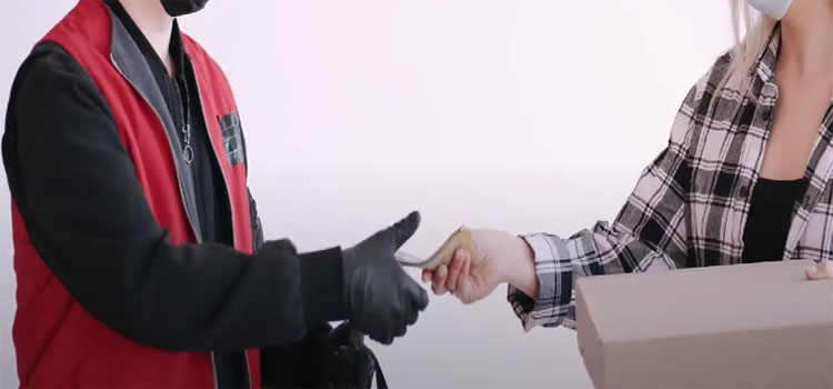 Woman Handing Payment to Delivery Guy